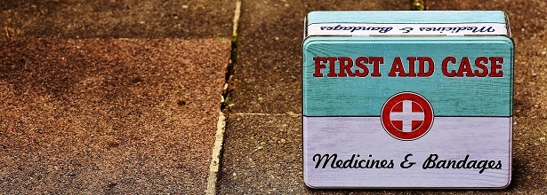 first aid box on pavement